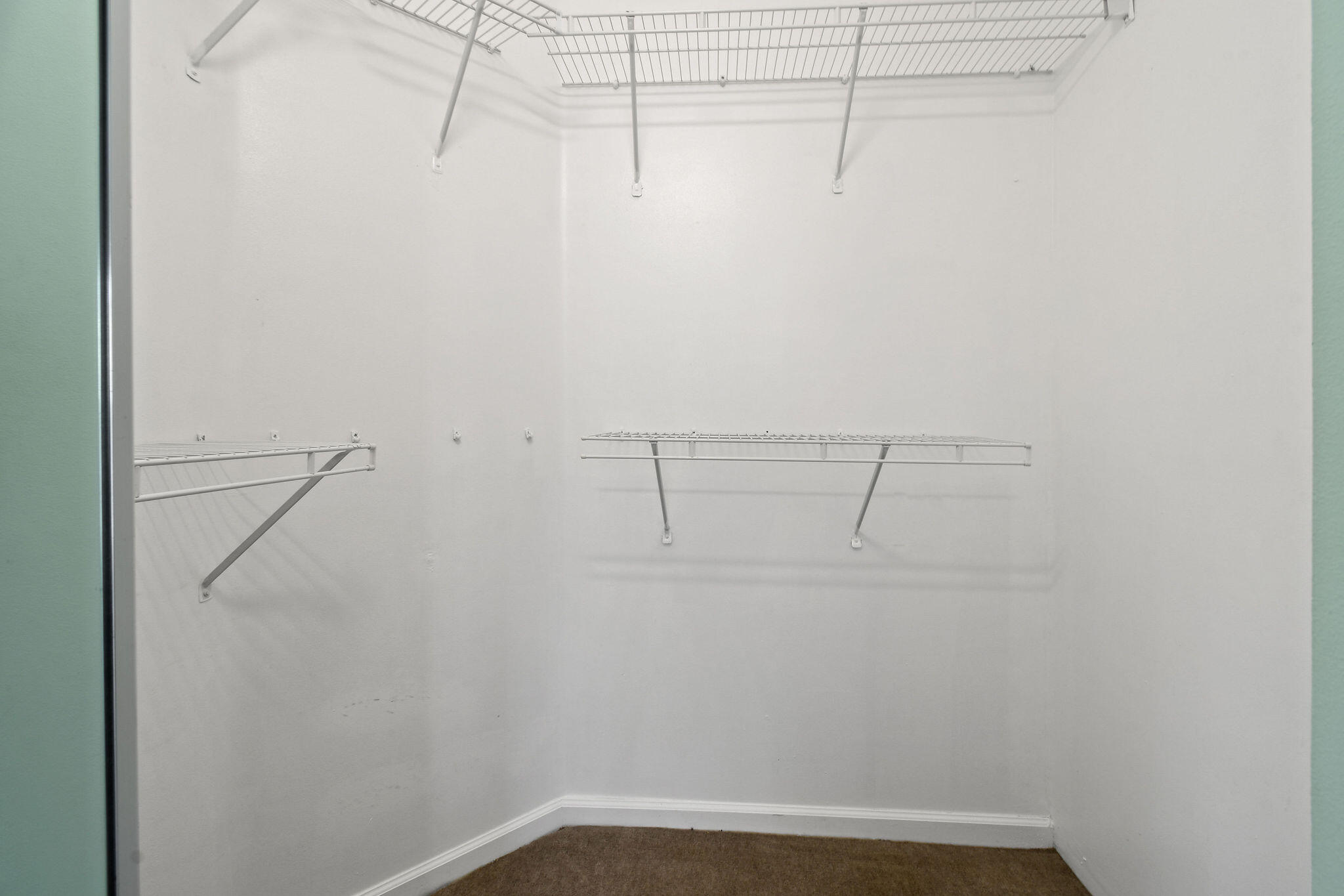 6293 Michael Street Jupiter, FL 33458 - Photo 24 of 64 a view of a room with racks on the wall