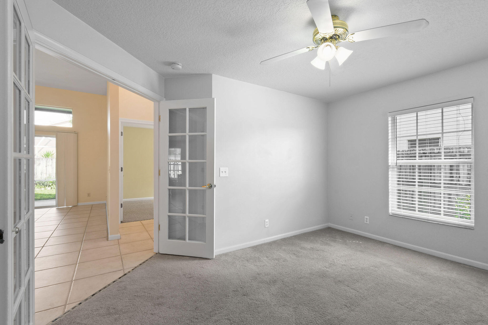 6293 Michael Street Jupiter, FL 33458 - Photo 31 of 64 an empty room with windows and fan