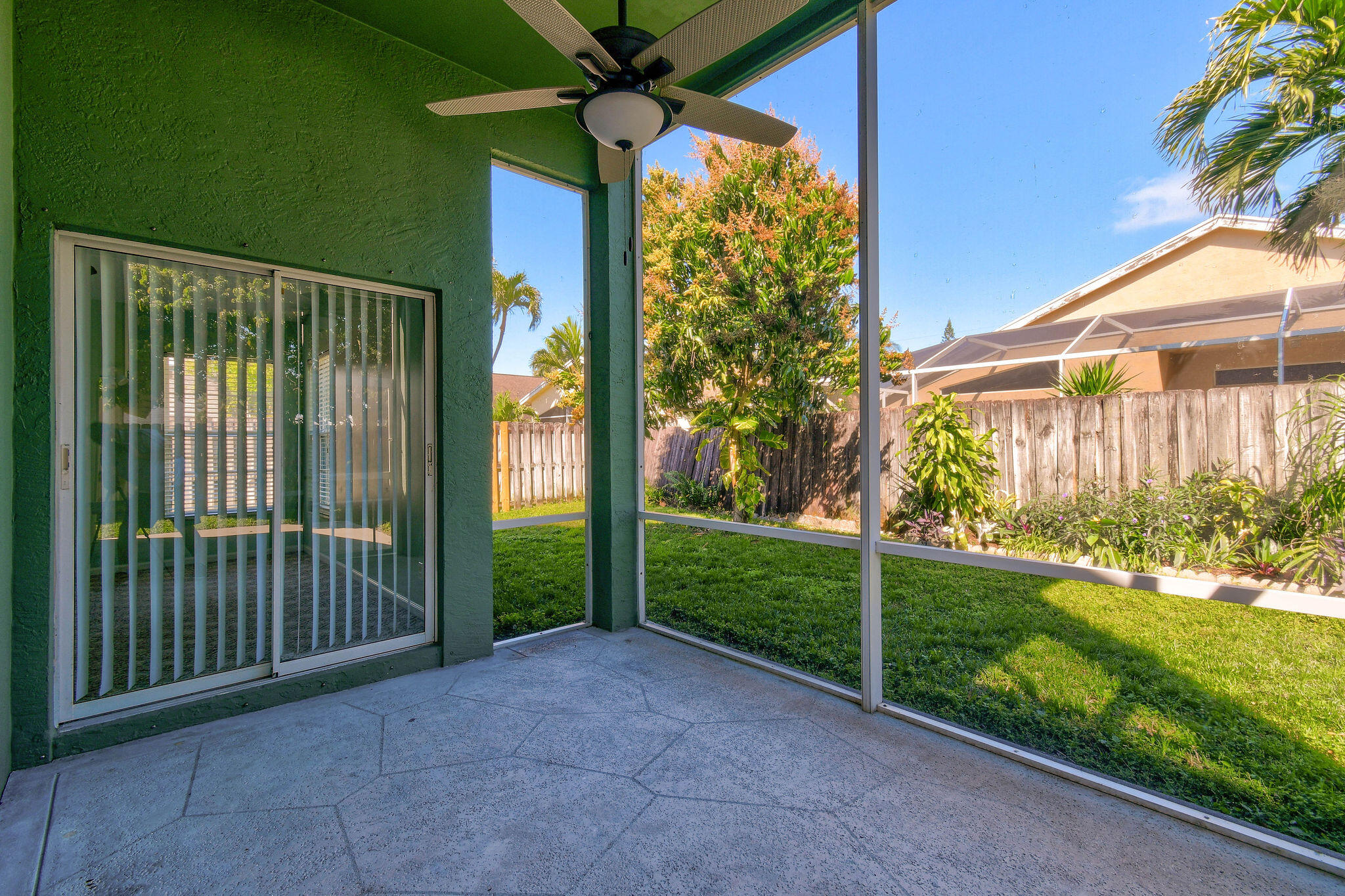 6293 Michael Street Jupiter, FL 33458 - Photo 40 of 64 a view of a house with a yard and potted plants