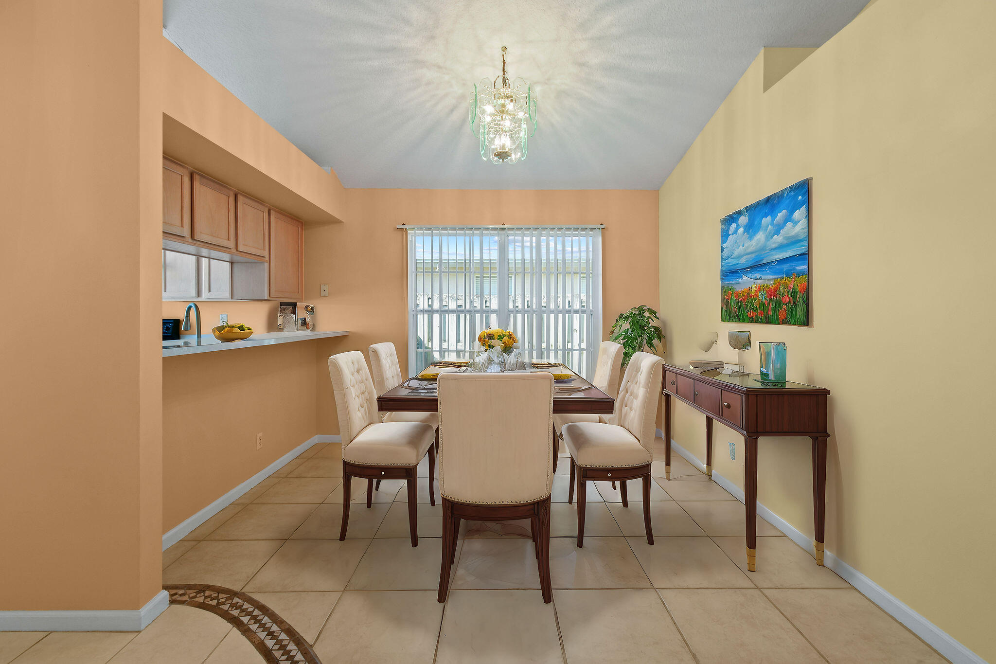 6293 Michael Street Jupiter, FL 33458 - Photo 7 of 64 a view of a dining room with furniture and a chandelier