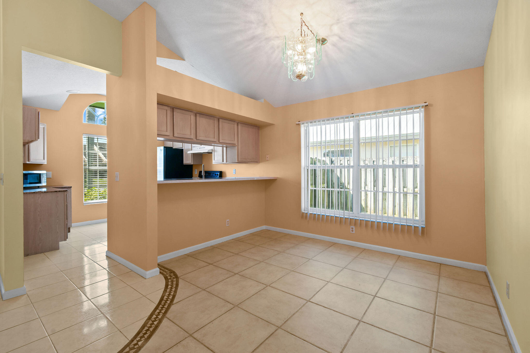 6293 Michael Street Jupiter, FL 33458 - Photo 9 of 64 a view of a kitchen with microwave and cabinets