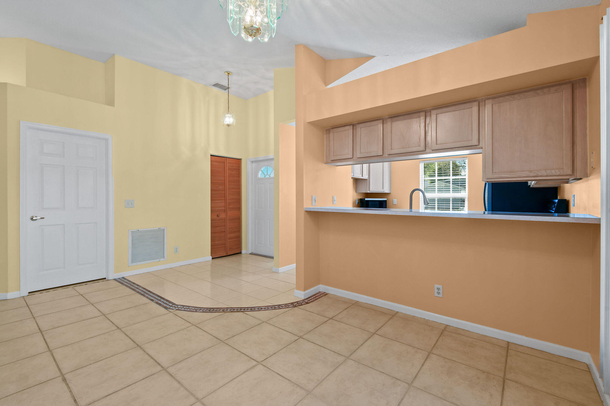 6293 Michael Street Jupiter, FL 33458 - Photo 10 of 64 a view of a kitchen with a sink and a window