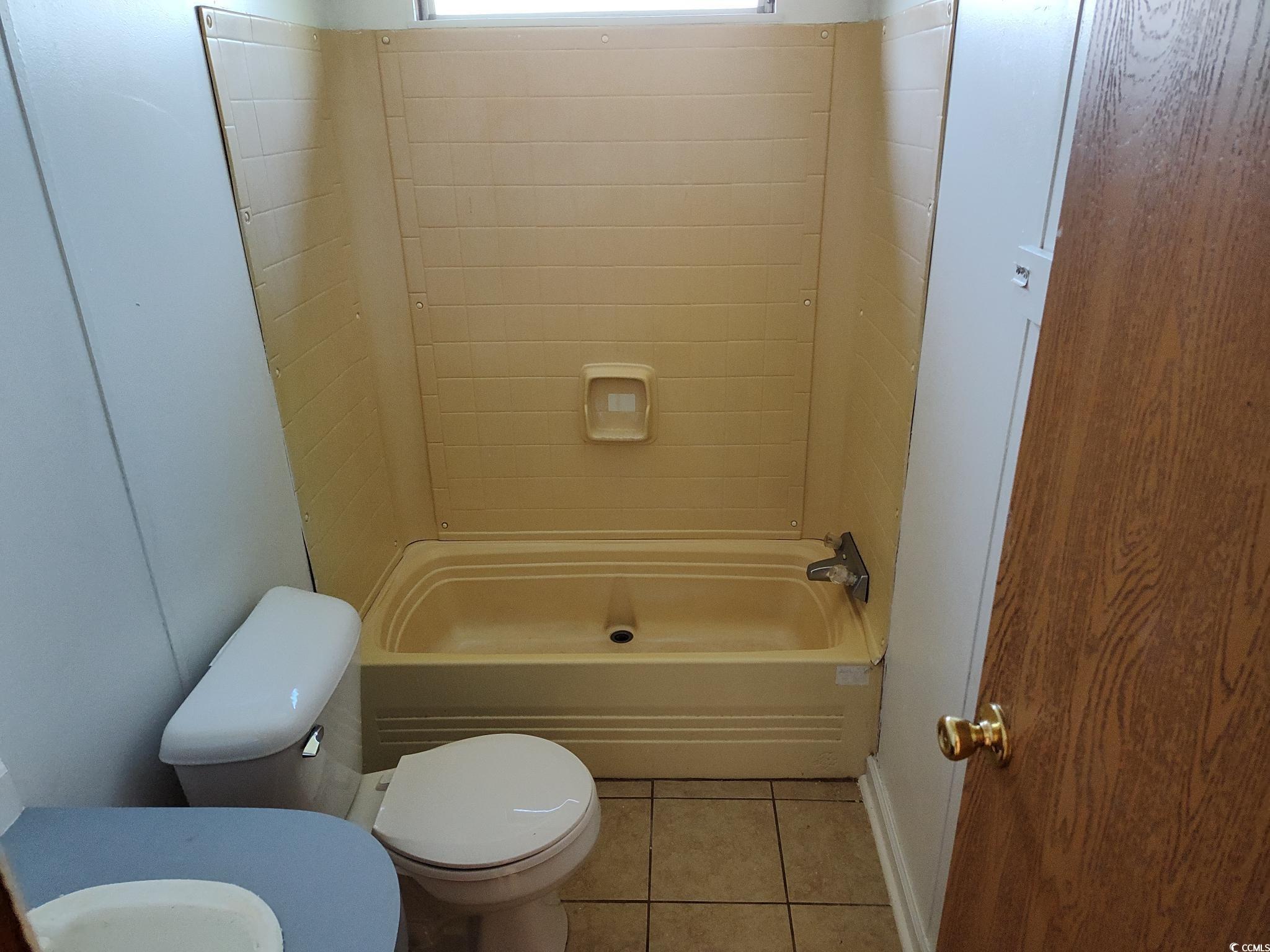 43 Newton Trail Andrews, SC 29510 - Photo 6 of 7 Bathroom with toilet, a tub, tile patterned flooring, and walk in shower