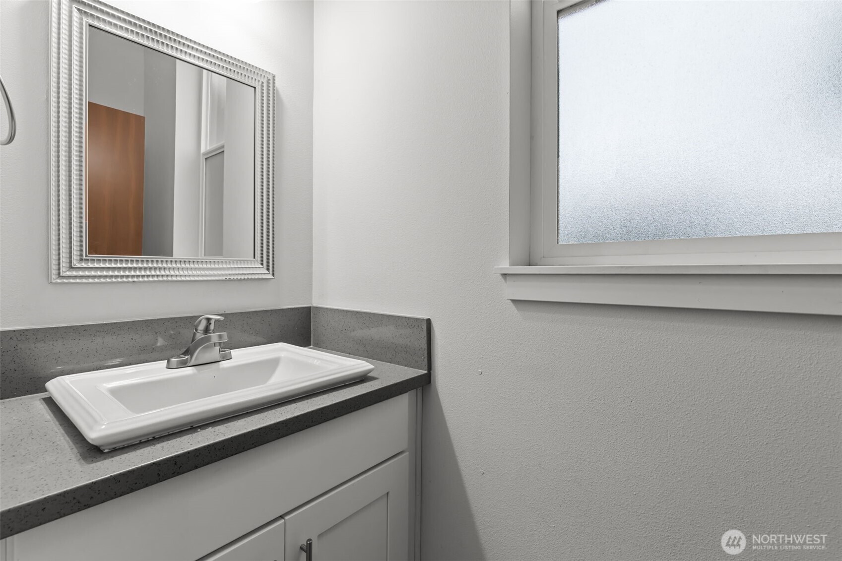 708 Miller Street Winlock, WA 98596 - Photo 13 of 40 a bathroom with a sink and a mirror