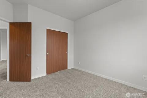 an empty room with closet area