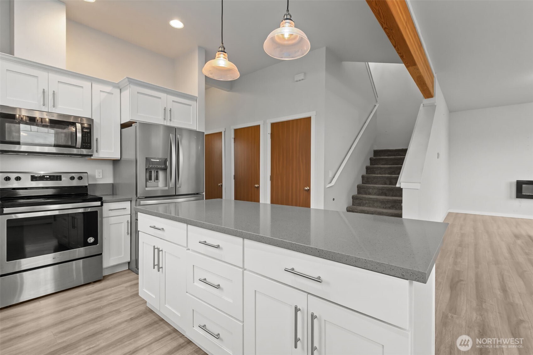 708 Miller Street Winlock, WA 98596 - Photo 8 of 40 a kitchen with granite countertop a stove and a refrigerator