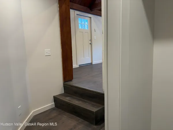 a view of entryway with wooden floor