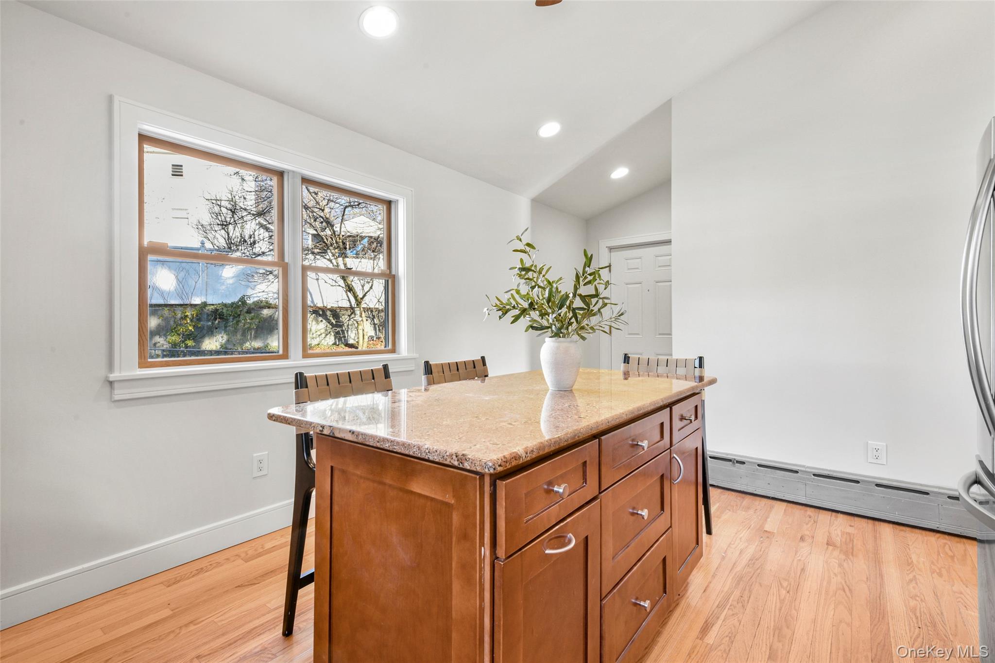 103 Old White Plains Road Tarrytown, NY 10591 - Photo 16 of 37 a kitchen that has a sink and a wooden floor