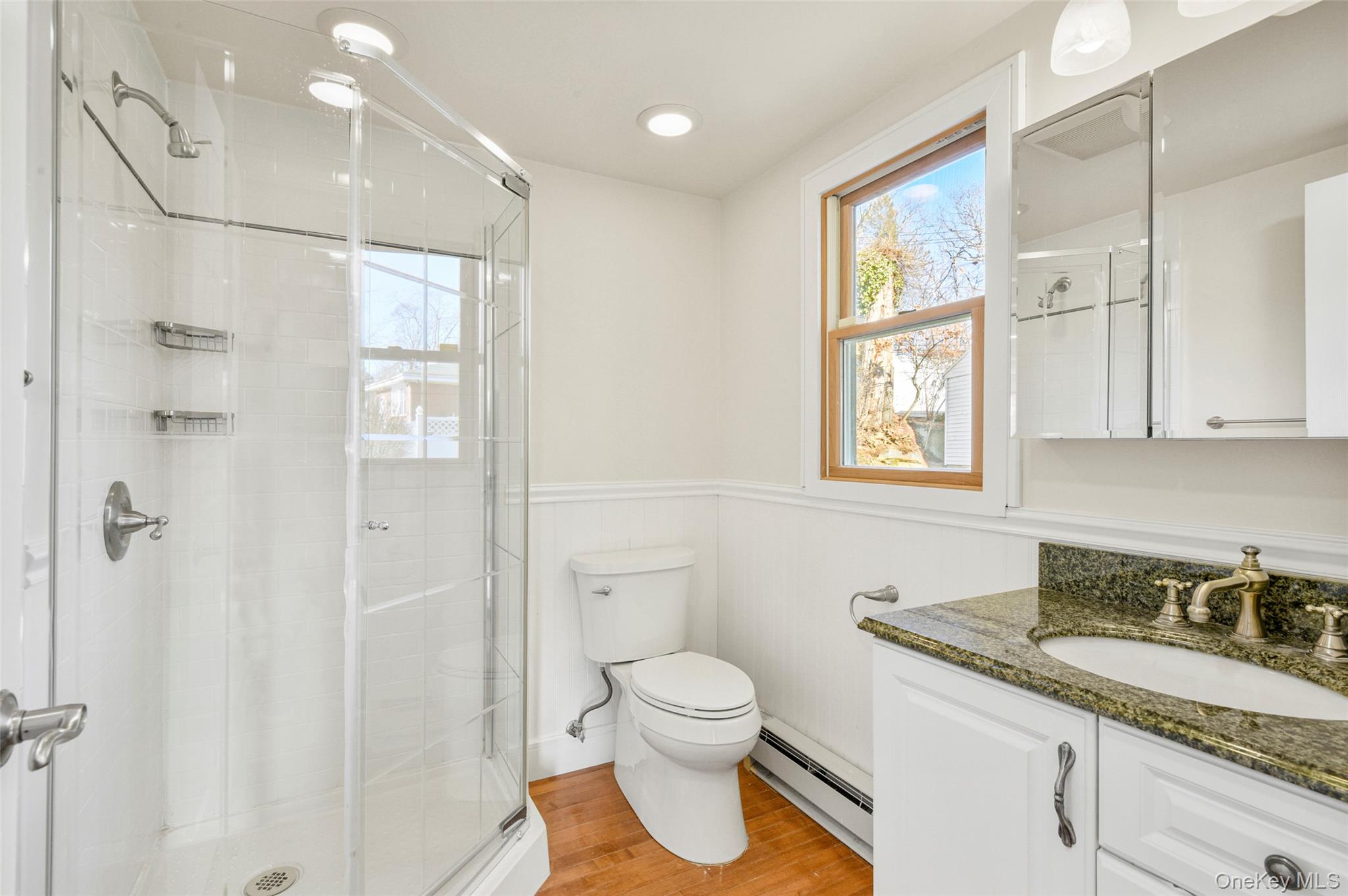 103 Old White Plains Road Tarrytown, NY 10591 - Photo 21 of 37 a bathroom with a granite countertop sink a toilet and shower