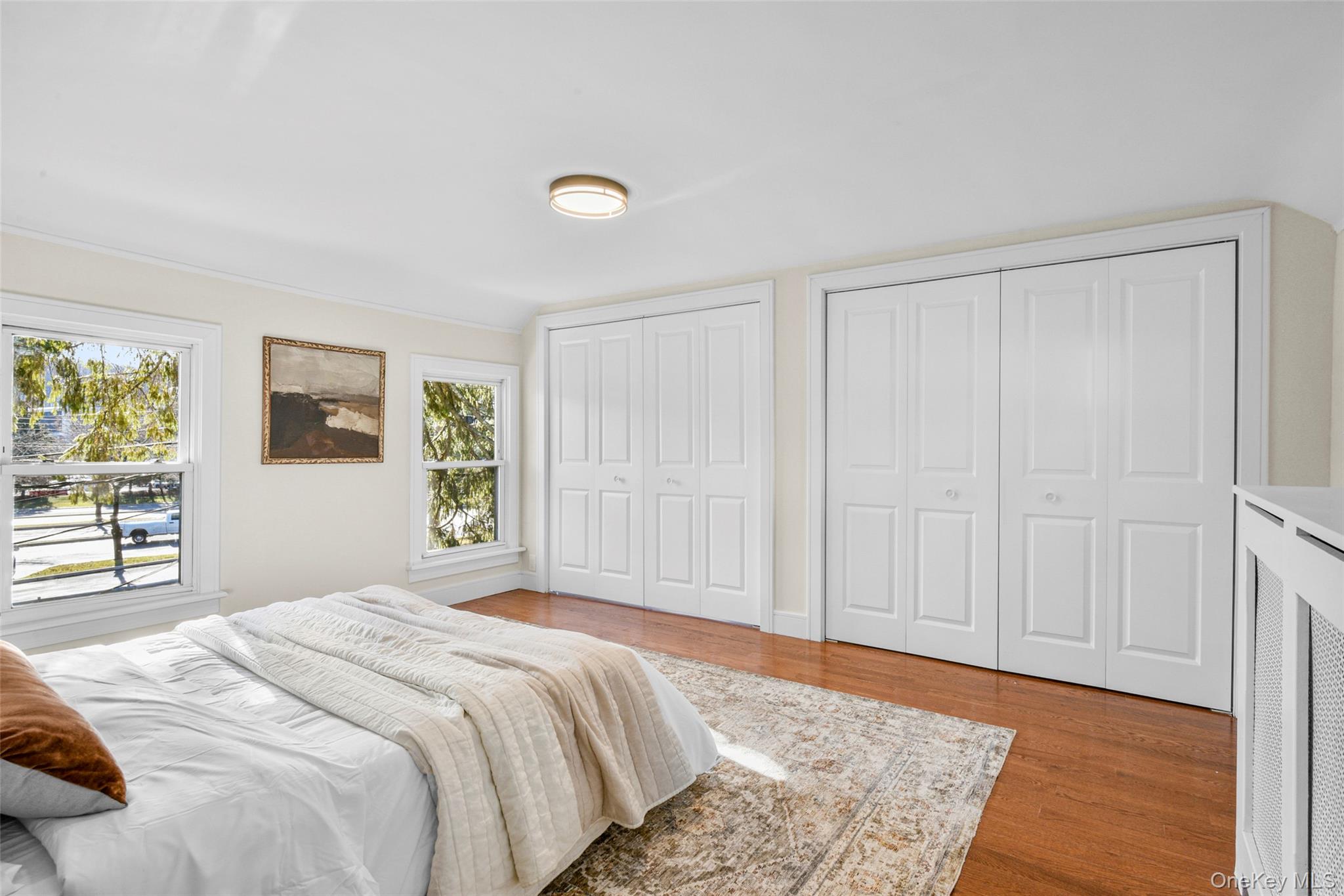 103 Old White Plains Road Tarrytown, NY 10591 - Photo 24 of 37 a bedroom with a bed and a window