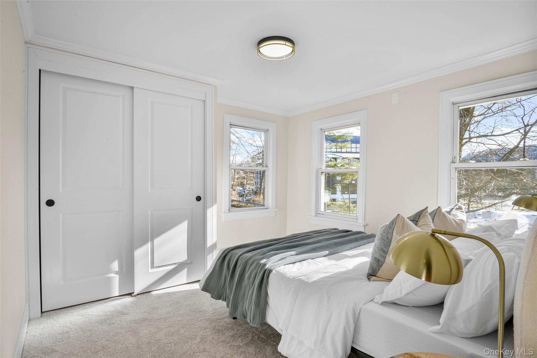 103 Old White Plains Road Tarrytown, NY 10591 - Photo 28 of 37 a bedroom with a bed and a window