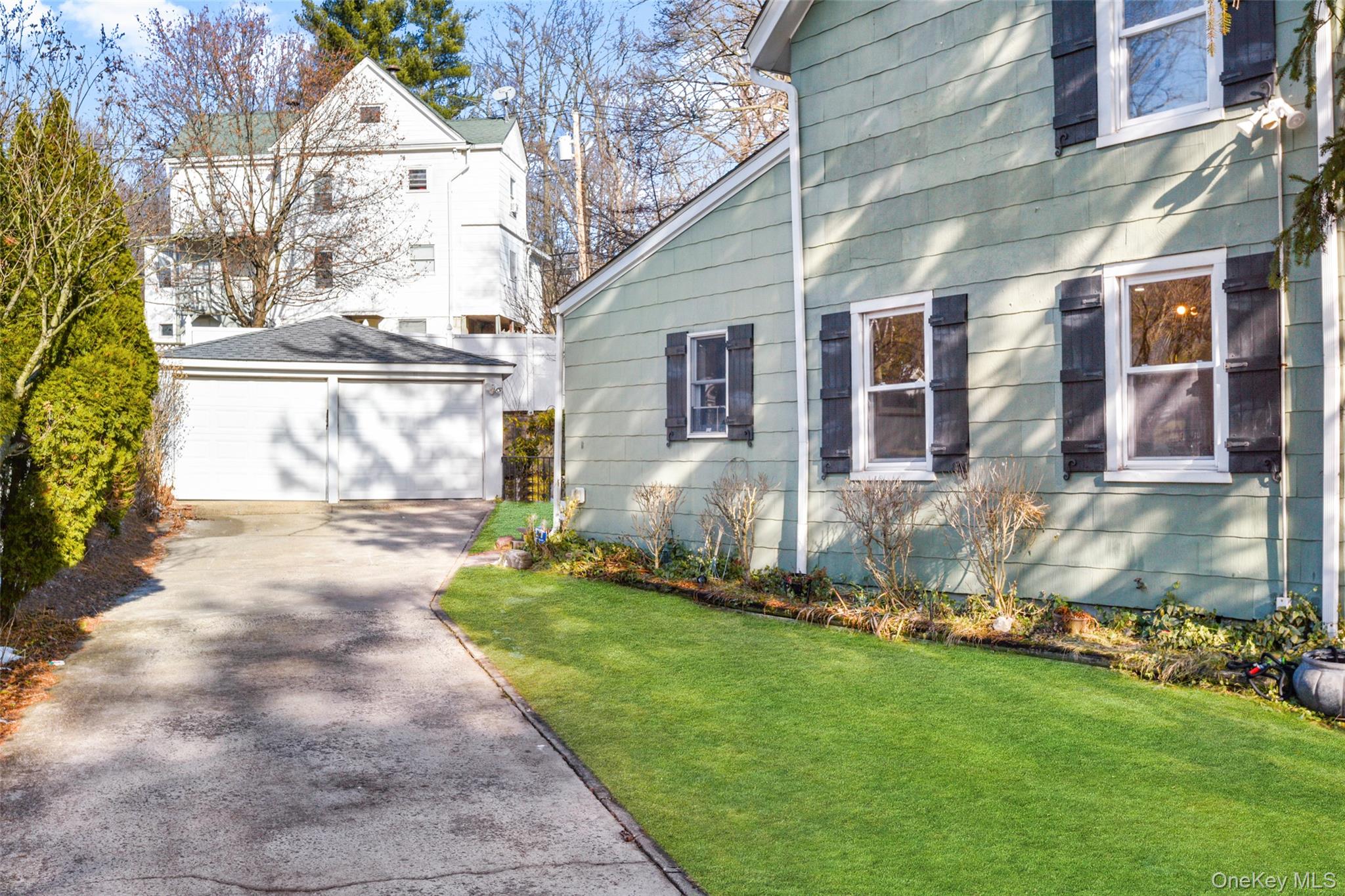 103 Old White Plains Road Tarrytown, NY 10591 - Photo 34 of 37 a view of a house with a yard