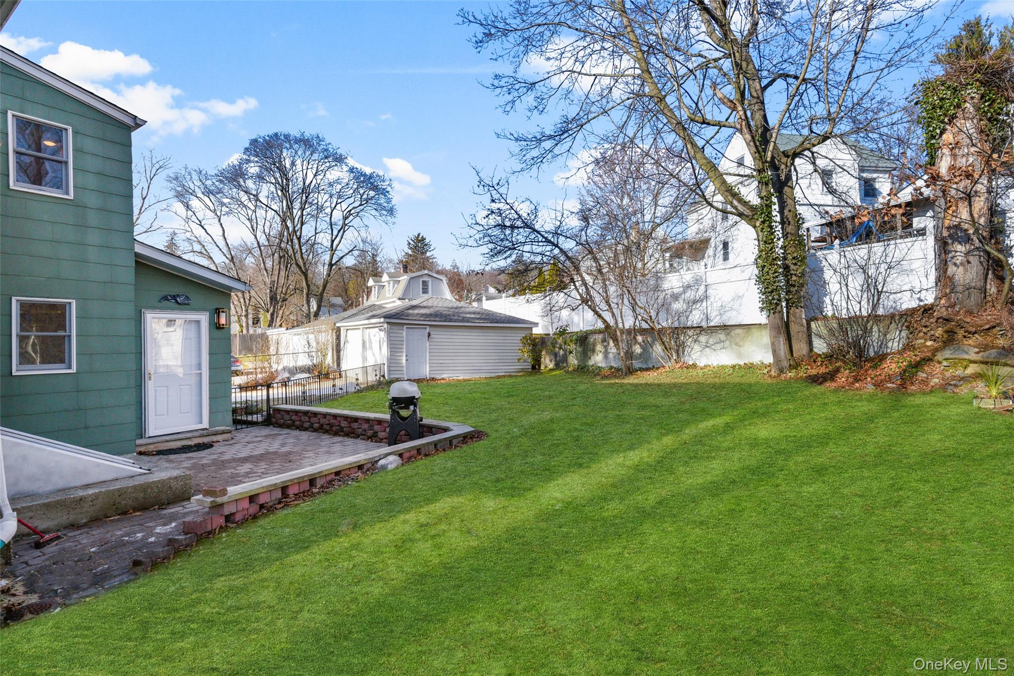 103 Old White Plains Road Tarrytown, NY 10591 - Photo 36 of 37 a view of a house with a yard