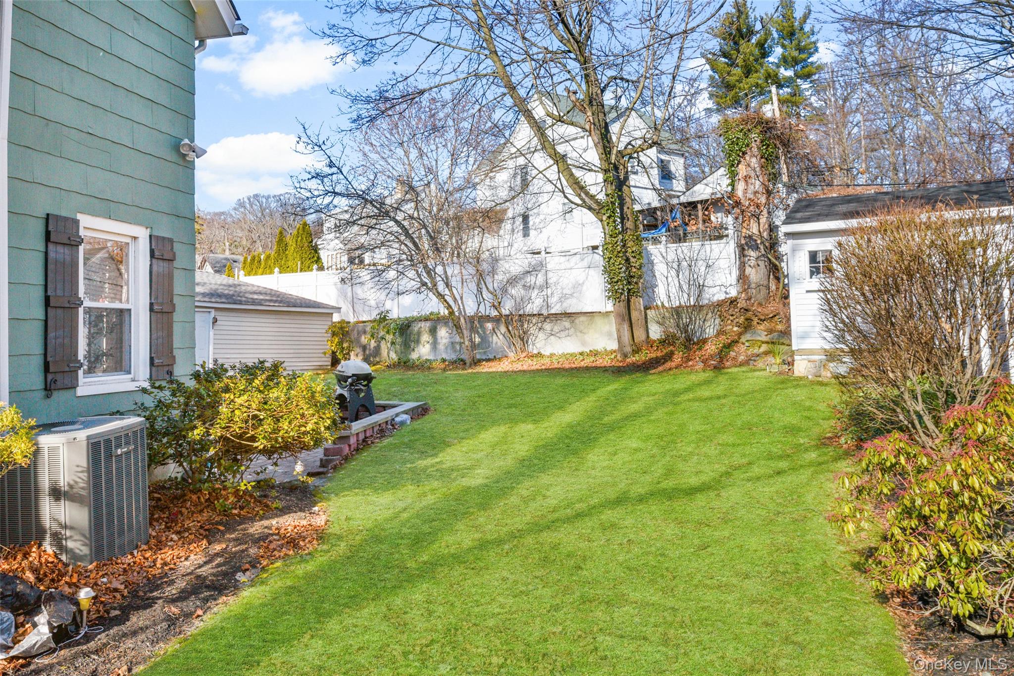 103 Old White Plains Road Tarrytown, NY 10591 - Photo 37 of 37 a front view of a house with garden