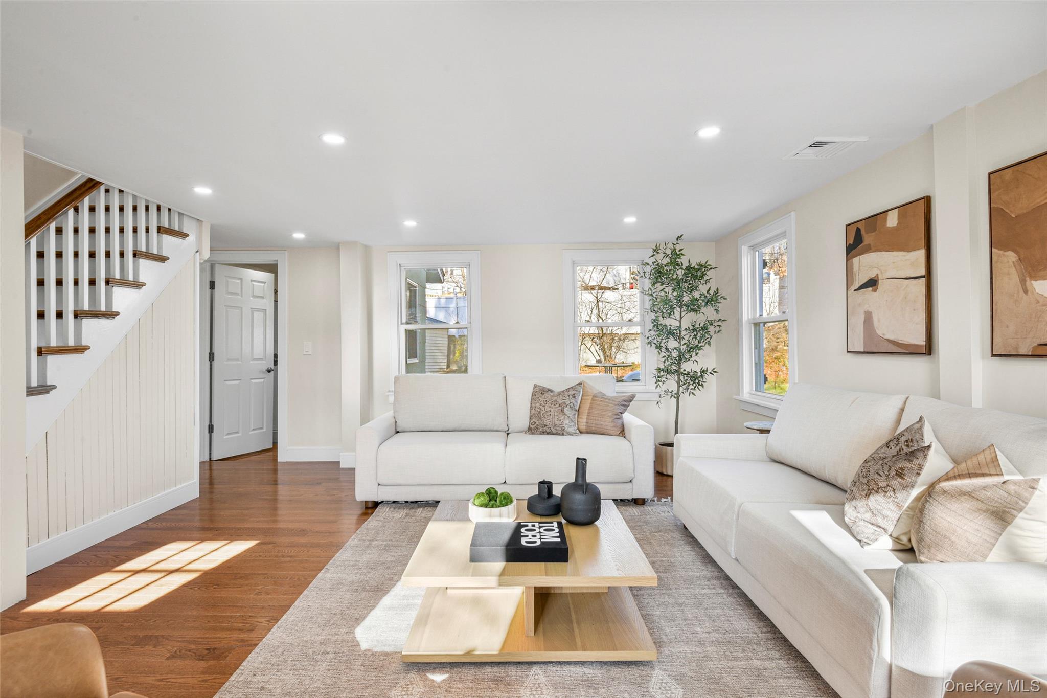 103 Old White Plains Road Tarrytown, NY 10591 - Photo 6 of 37 a living room with furniture wooden floor and white walls