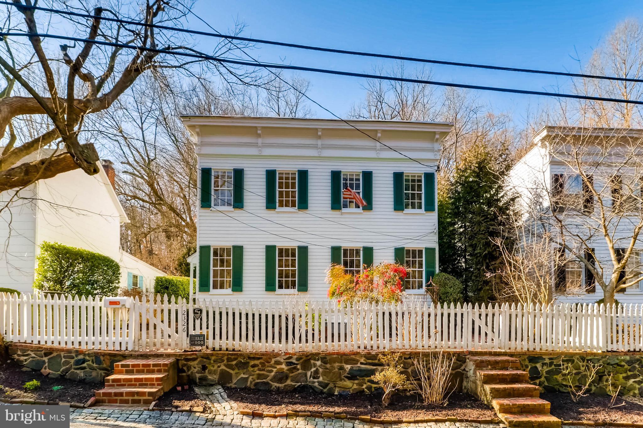 2326 Pickwick Road Baltimore, MD 21207 - Photo 1 of 30 a front view of a house with a garden