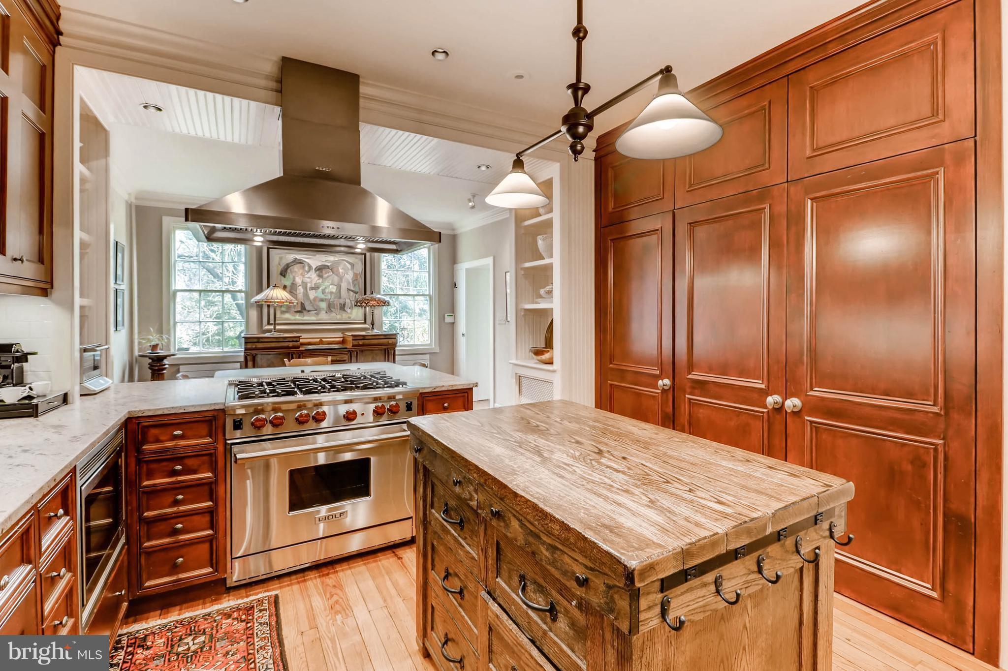 2326 Pickwick Road Baltimore, MD 21207 - Photo 12 of 30 a kitchen with a stove and a refrigerator