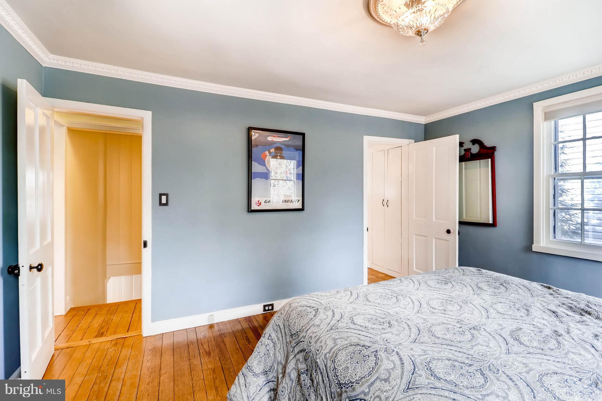2326 Pickwick Road Baltimore, MD 21207 - Photo 16 of 30 a bedroom with a bed and a window