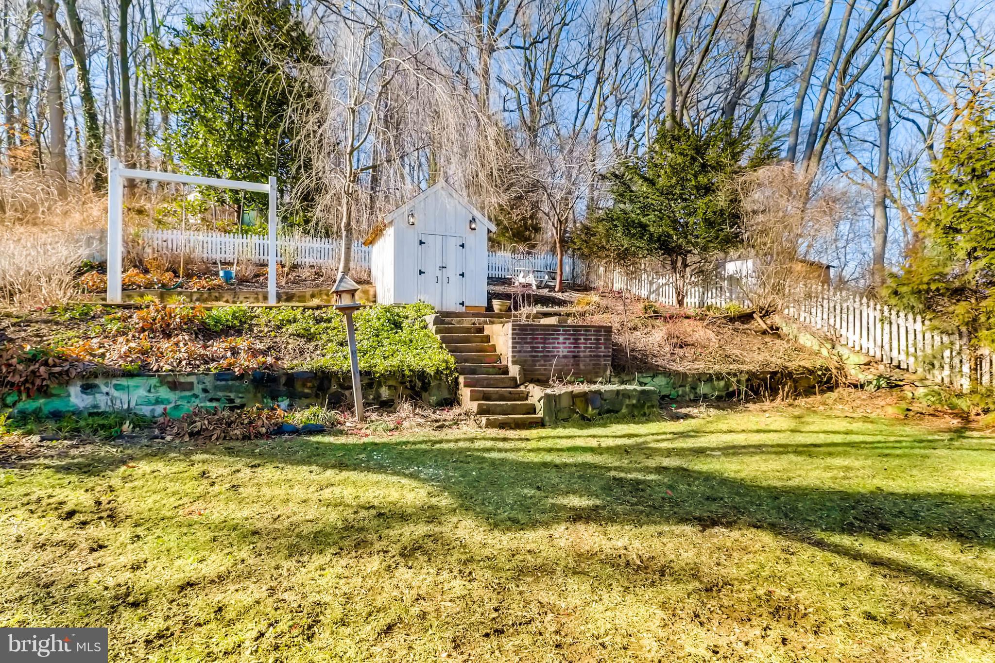 2326 Pickwick Road Baltimore, MD 21207 - Photo 29 of 30 a view of a fountain in front of a house