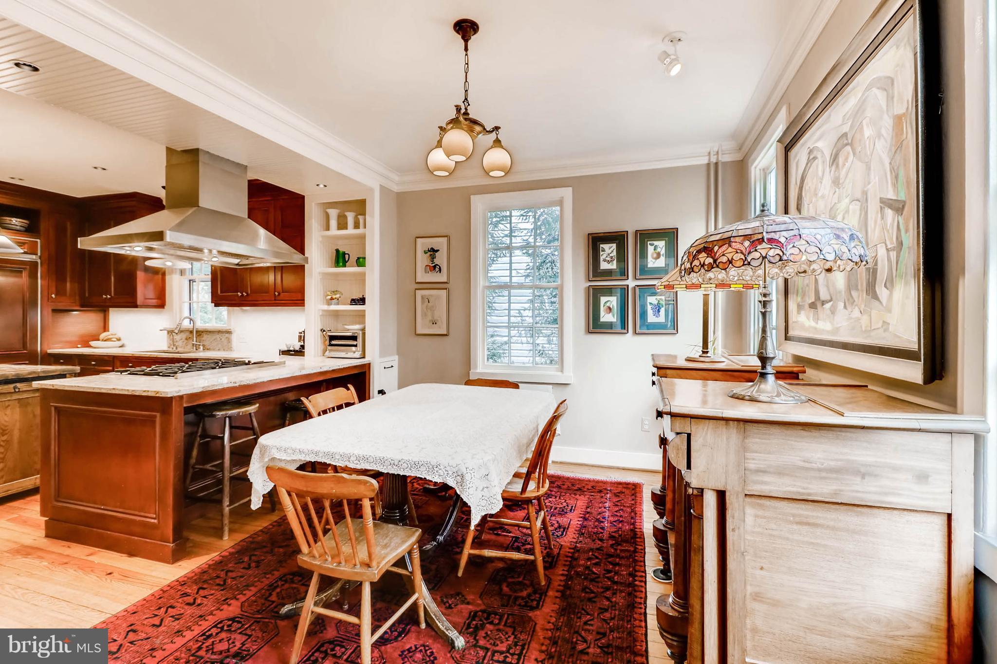 2326 Pickwick Road Baltimore, MD 21207 - Photo 6 of 30 a view of a dining room with furniture and chandelier
