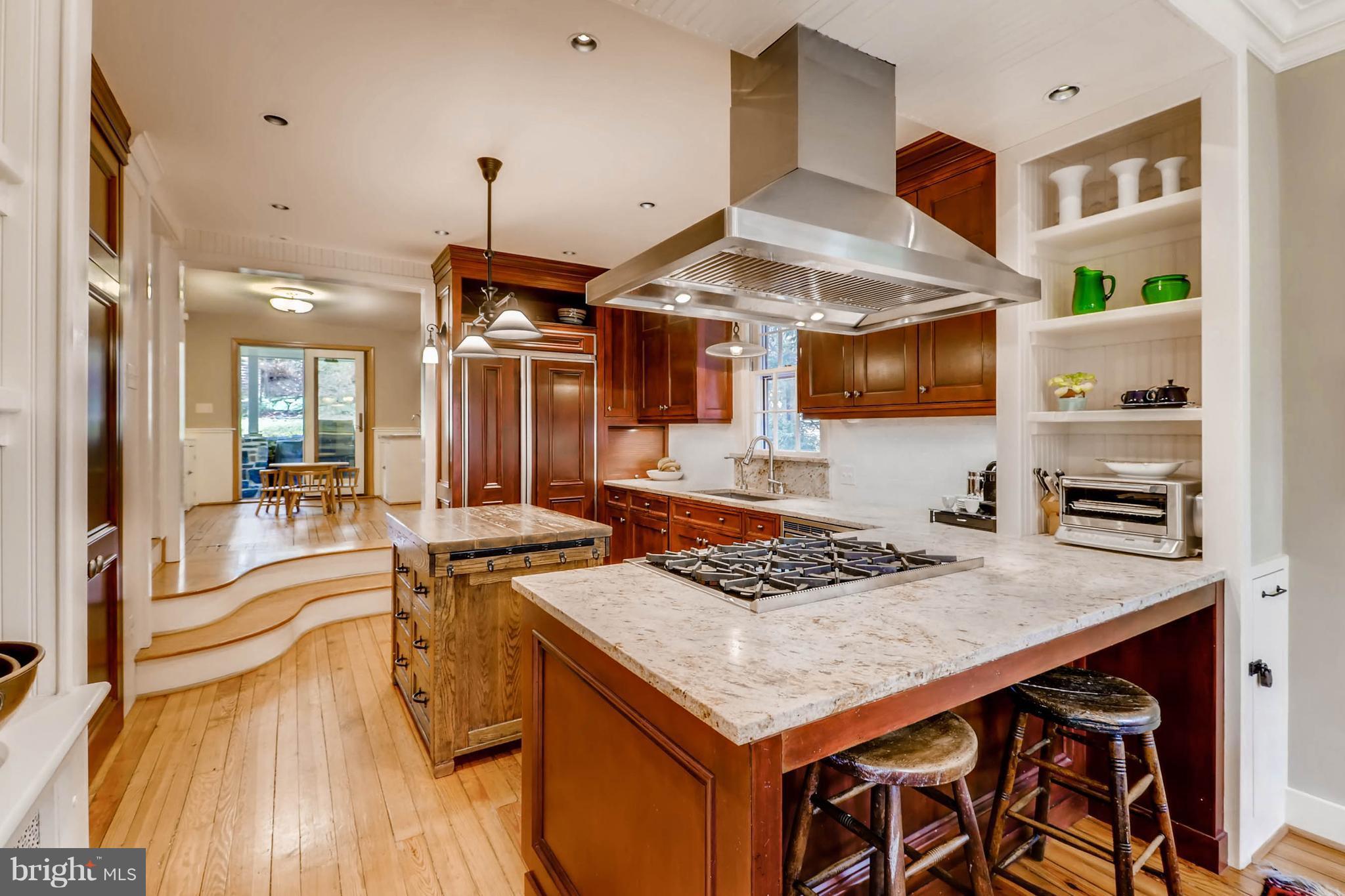 2326 Pickwick Road Baltimore, MD 21207 - Photo 9 of 30 a open kitchen with stainless steel appliances granite countertop a stove and a sink