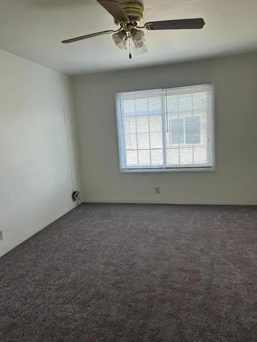 an empty room with a empty space and windows