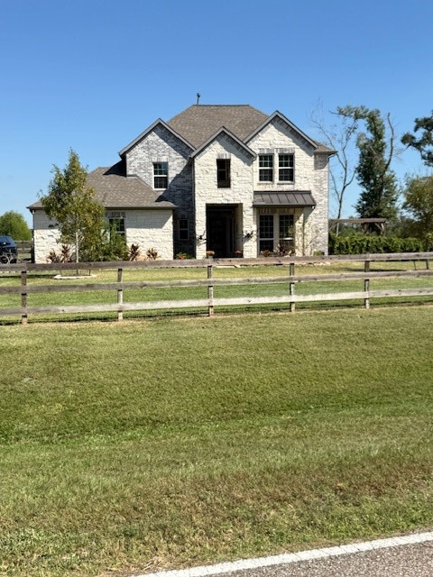 21603 Chenango Lake Drive Angleton, TX 77515 - Photo 13 of 14 a front view of a house with a garden