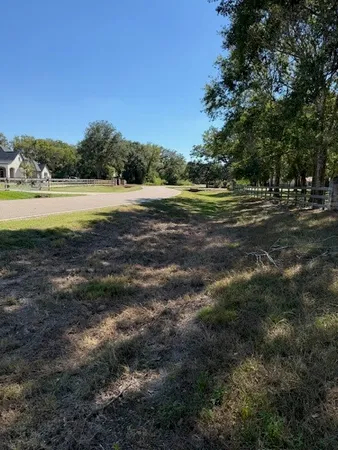 a view of outdoor space with trees all around