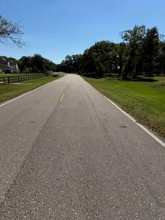 a view of a field and mountains in the background