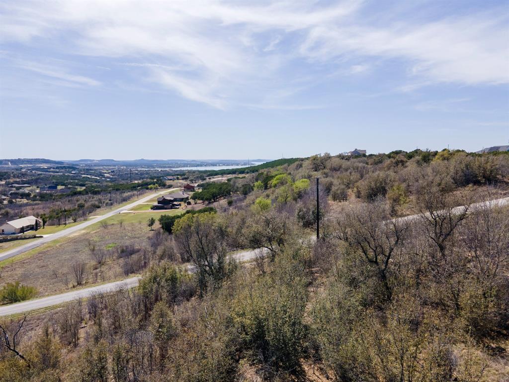 Lot 764 Sawtooth Mountain Road Graford, TX 76449 - Photo 2 of 18 an aerial view of residential houses with outdoor space and trees