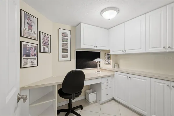 a view of a workspace with furniture