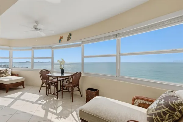 a view of a dining room with furniture and a window