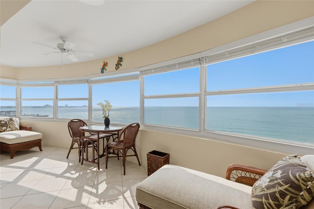 1750 Benjamin Franklin Drive, Unit 9B Sarasota, FL 34236 - Photo 16 of 47 a view of a dining room with furniture and a window