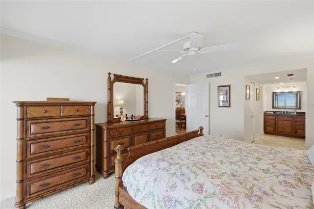 a bed room with a bed and a television