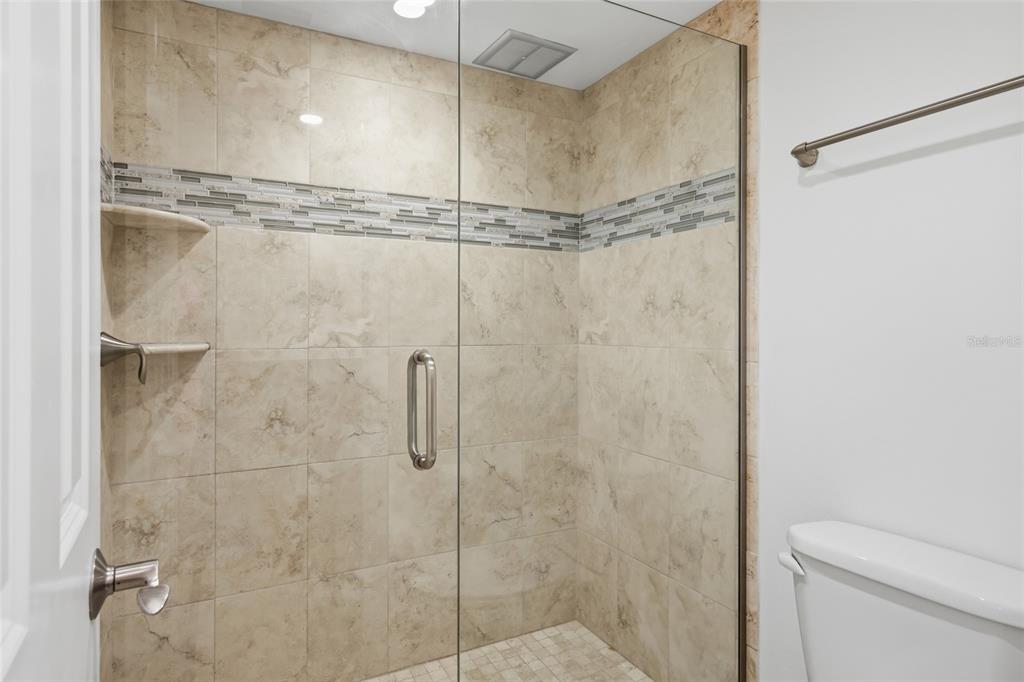 1750 Benjamin Franklin Drive, Unit 9B Sarasota, FL 34236 - Photo 23 of 47 a bathroom with a shower
