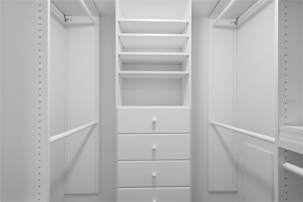 1750 Benjamin Franklin Drive, Unit 9B Sarasota, FL 34236 - Photo 24 of 47 a view of walk in closet