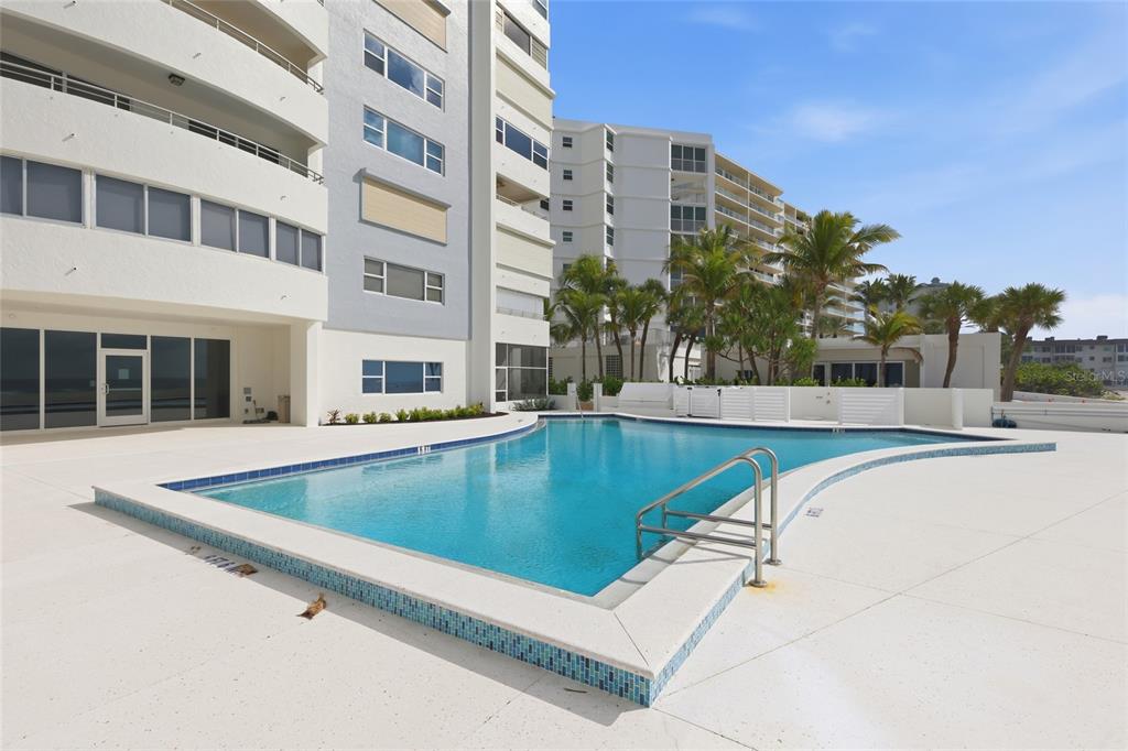 1750 Benjamin Franklin Drive, Unit 9B Sarasota, FL 34236 - Photo 34 of 47 a view of a building with a swimming pool