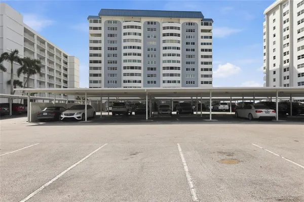 a view of building with cars