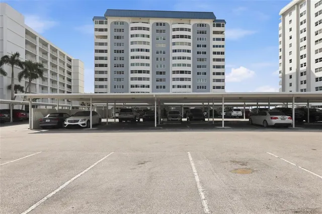 a view of building with cars