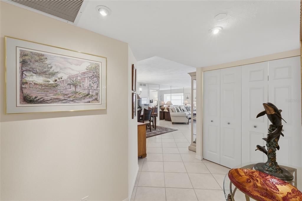 1750 Benjamin Franklin Drive, Unit 9B Sarasota, FL 34236 - Photo 6 of 47 a view of a hallway with workspace and a window