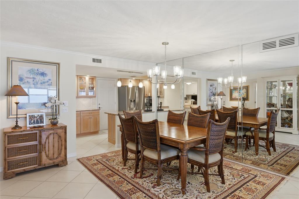1750 Benjamin Franklin Drive, Unit 9B Sarasota, FL 34236 - Photo 9 of 47 a view of a dining room with furniture