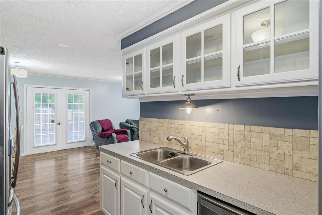 323 Rustic Road Hideaway, TX 75771 - Photo 12 of 40 a kitchen with a sink and a window