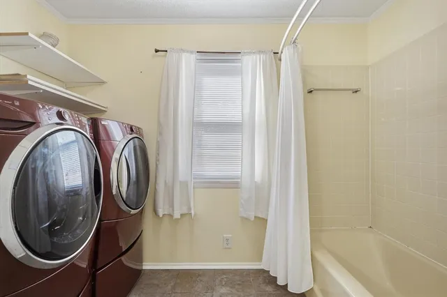 an aerial view of a house with a lake view