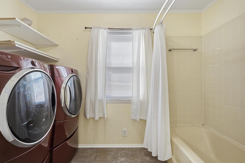 323 Rustic Road Hideaway, TX 75771 - Photo 21 of 40 a bathroom with a sink a toilet and shower