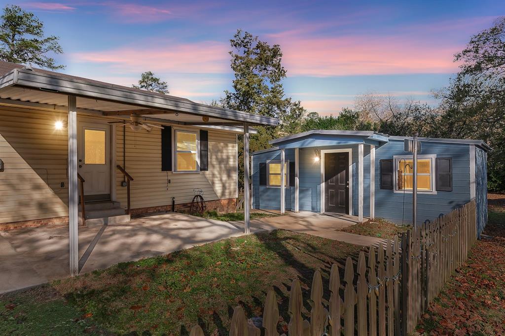 323 Rustic Road Hideaway, TX 75771 - Photo 25 of 40 a front view of a house with a yard