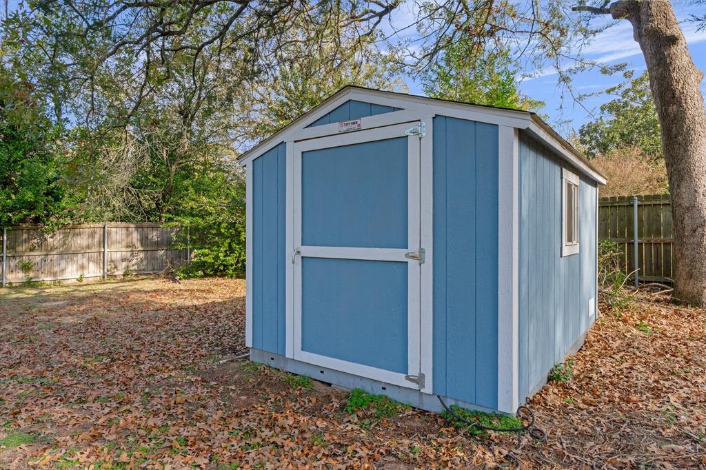 323 Rustic Road Hideaway, TX 75771 - Photo 28 of 40 a front view of a house with garden