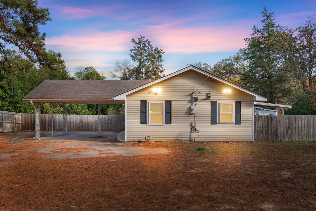 323 Rustic Road Hideaway, TX 75771 - Photo 40 of 40 a view of house with backyard space and garden
