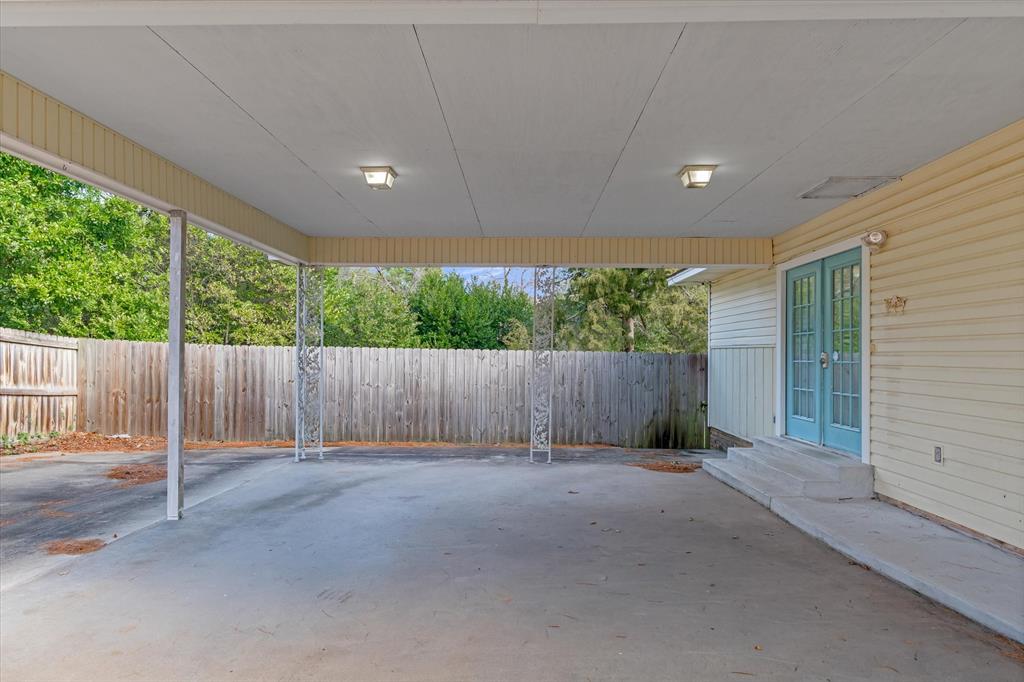 323 Rustic Road Hideaway, TX 75771 - Photo 4 of 40 a view of backyard with wooden fence