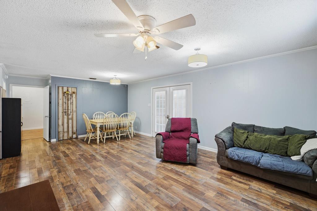 323 Rustic Road Hideaway, TX 75771 - Photo 7 of 40 a living room with furniture a dining table and a piano table