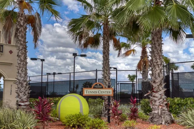 a view of a swimming pool with a table and chairs